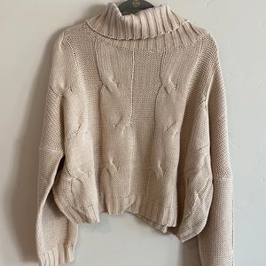 Cream knit turtleneck.